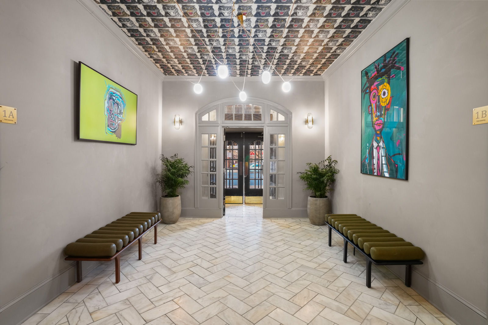 The Harper curated common area with designer art and herringbone floors