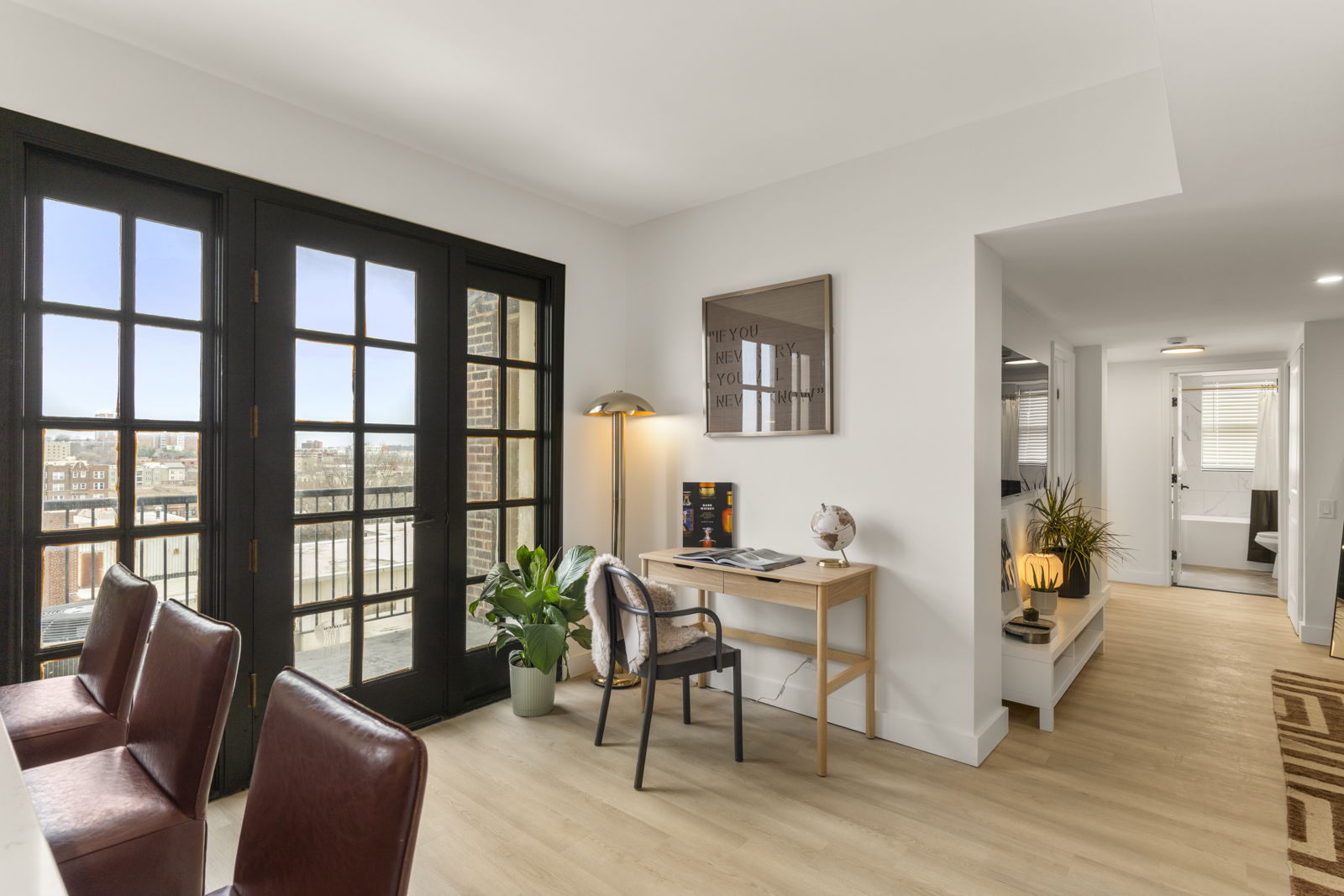 Harper living room with French doors and warm city light